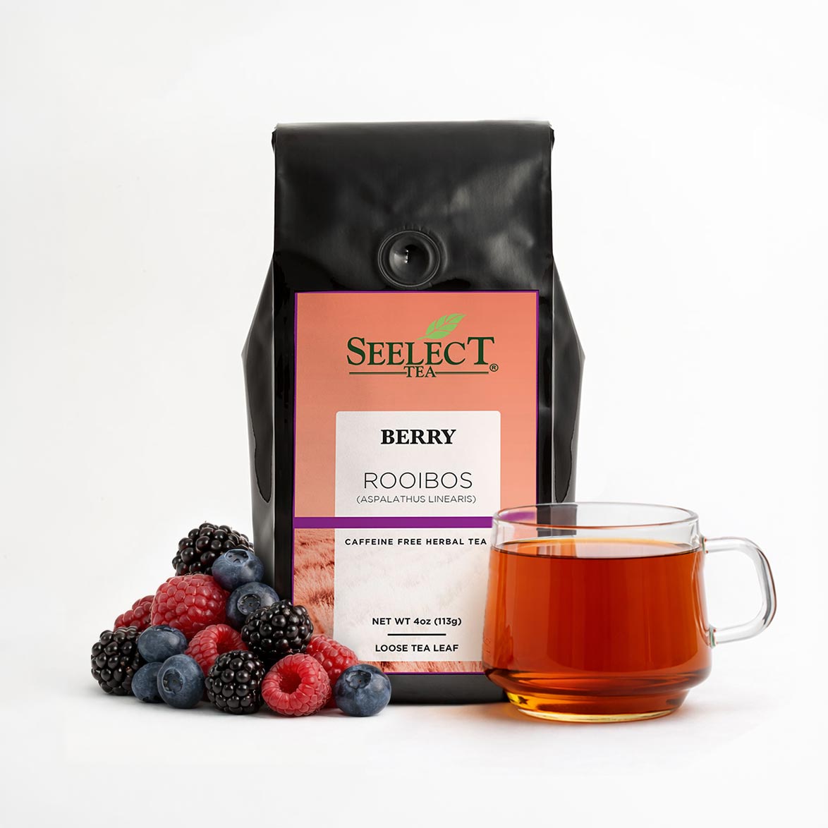 Berry Rooibos tea bag with 'Seelect Tea' label, cup of tea, and berries on a white background
