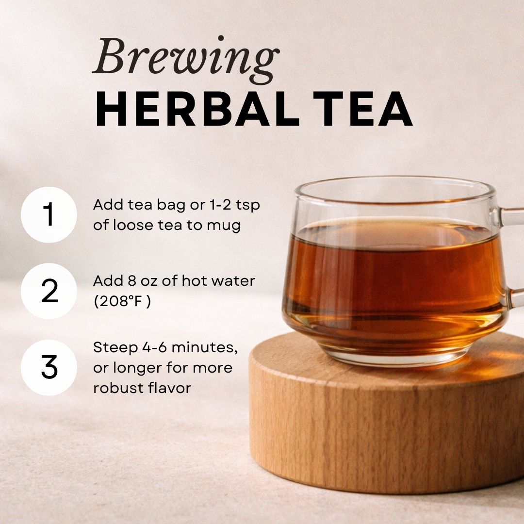 Glass mug of brewed herbal tea on a wooden coaster with brewing instructions.